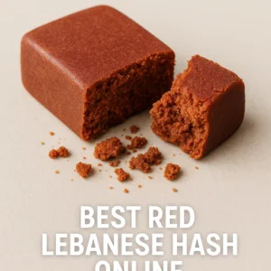 close-up of red lebanese hash cube with crumbly interior and crumbs on beige background, best red lebanese hash online